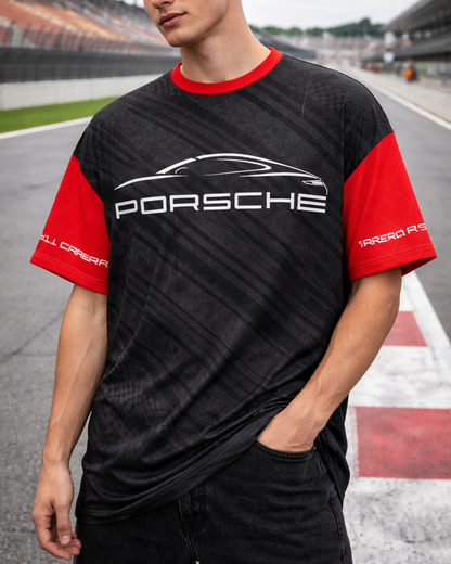 Person wearing a black and red Porsche t-shirt on a race track